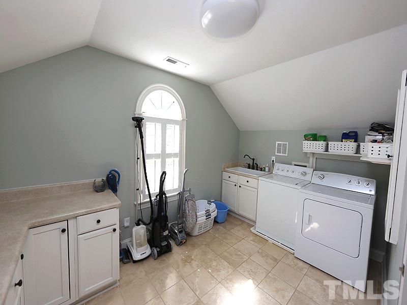 2805 Rothgeb Drive Raleigh, NC 27609 - Photo 16 of 25 a view of a storage & utility room with washer and dryer