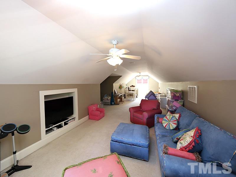 2805 Rothgeb Drive Raleigh, NC 27609 - Photo 20 of 25 a living room with furniture and a fireplace