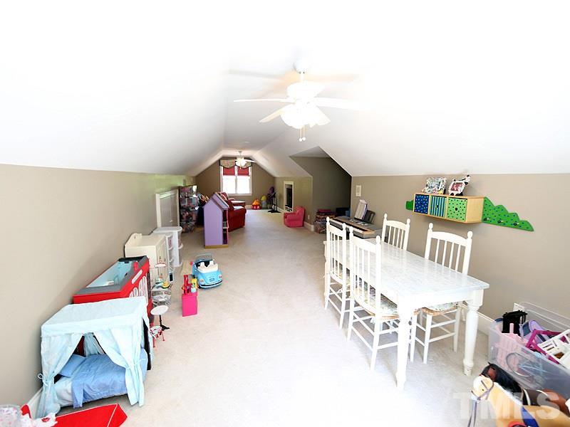 2805 Rothgeb Drive Raleigh, NC 27609 - Photo 21 of 25 a bedroom with furniture and a wooden floor