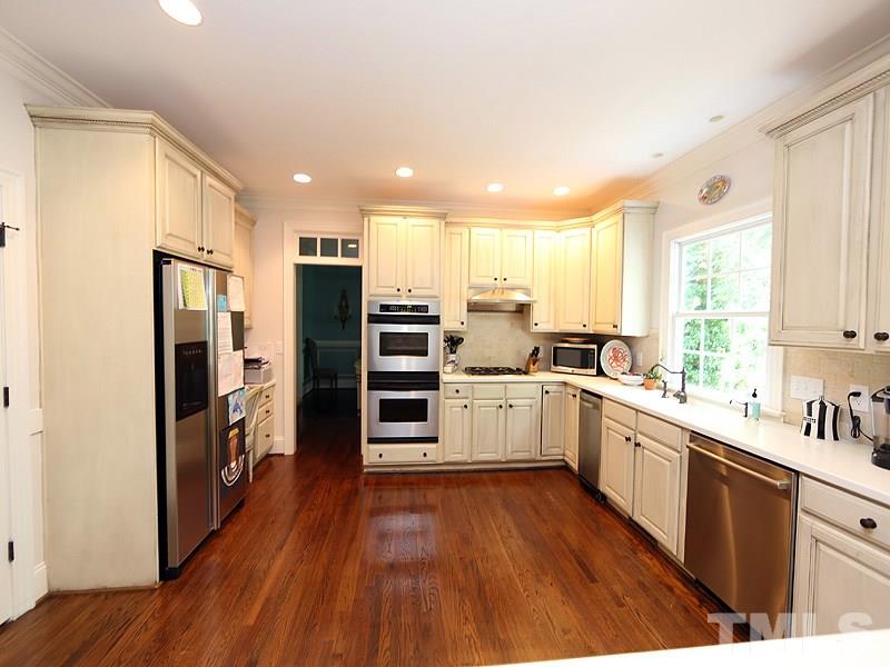 2805 Rothgeb Drive Raleigh, NC 27609 - Photo 5 of 25 a kitchen with stainless steel appliances a refrigerator sink and microwave