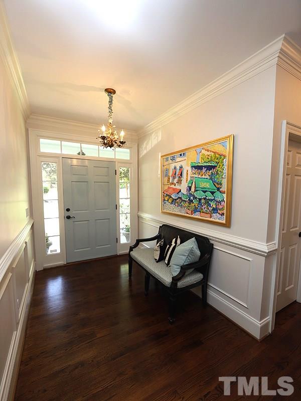 2805 Rothgeb Drive Raleigh, NC 27609 - Photo 7 of 25 a living room with furniture and a chandelier