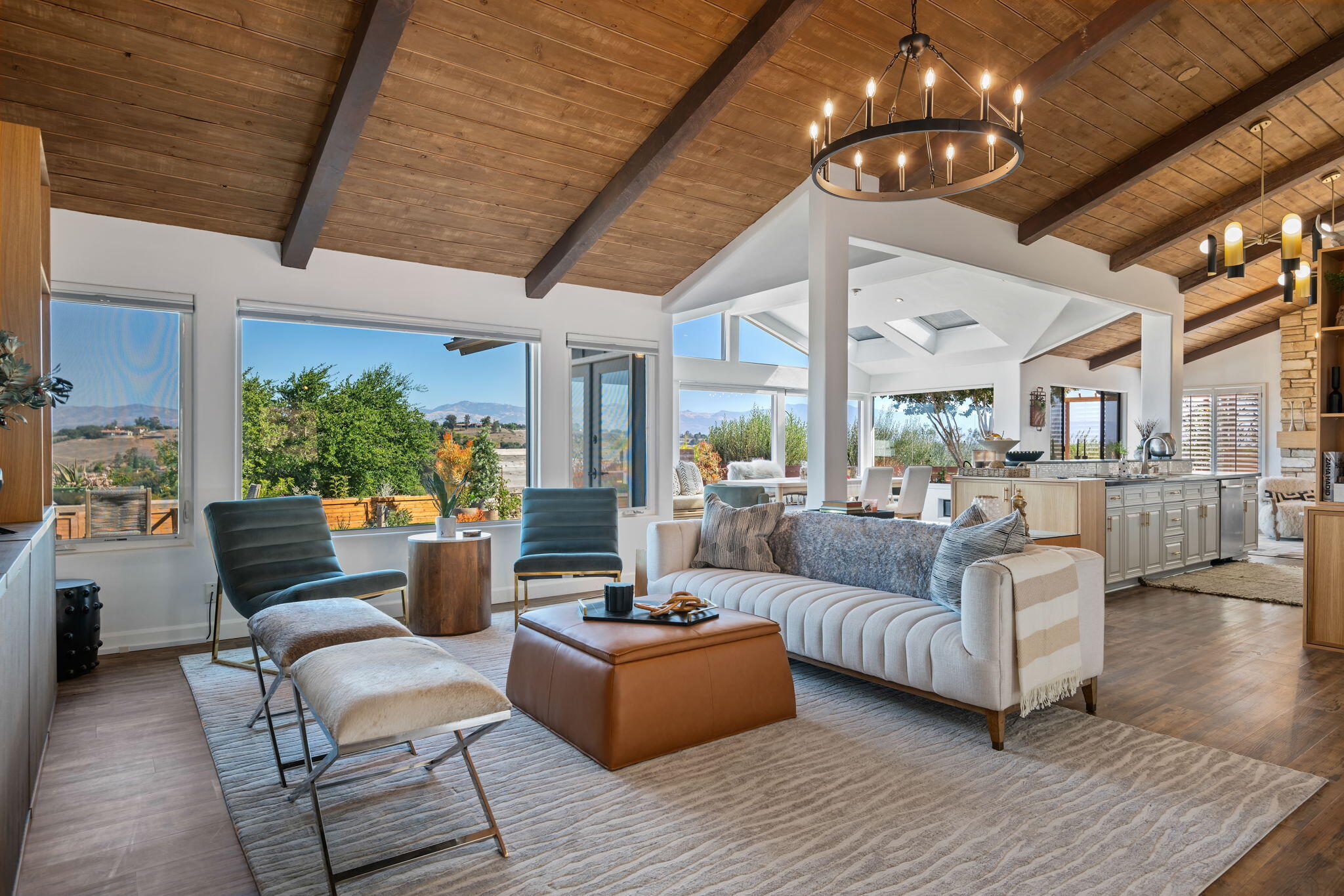 793 Alisal Road Solvang, CA 93463 - Photo 1 of 44 a living room with furniture a chandelier and a large window