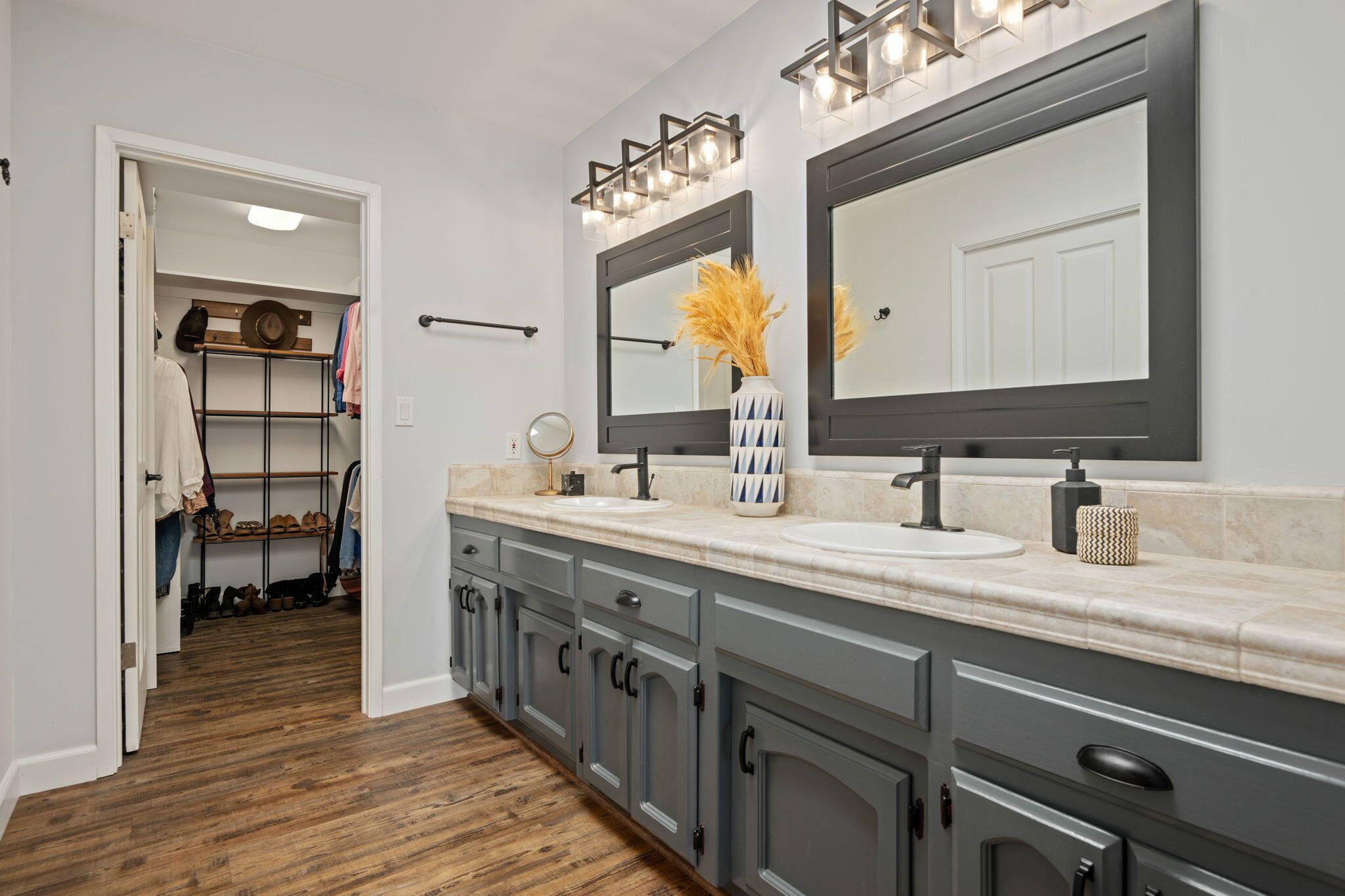 793 Alisal Road Solvang, CA 93463 - Photo 21 of 44 a spacious bathroom with a double vanity sink and a mirror