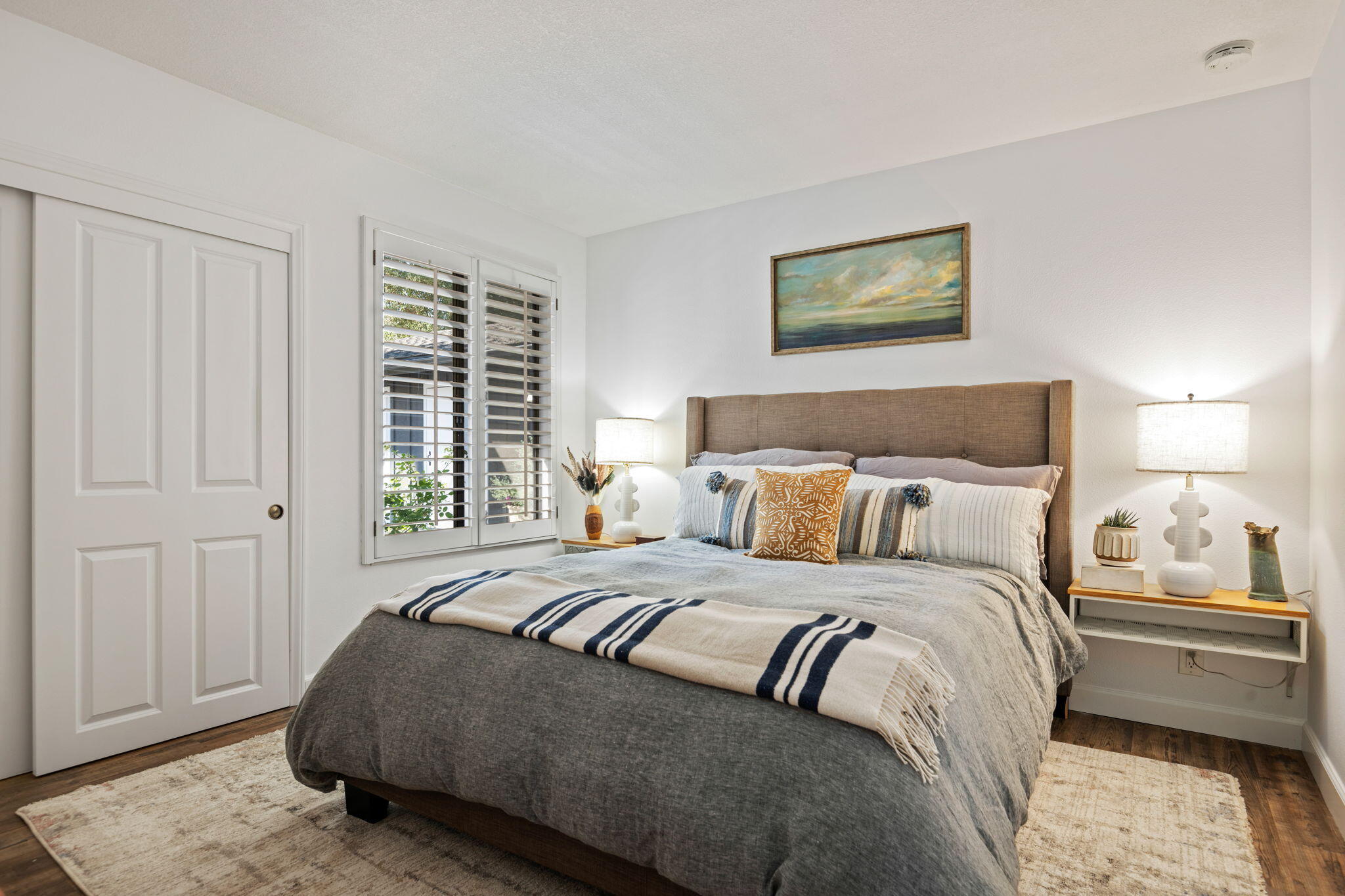 793 Alisal Road Solvang, CA 93463 - Photo 22 of 44 a bedroom with a bed and a night stand