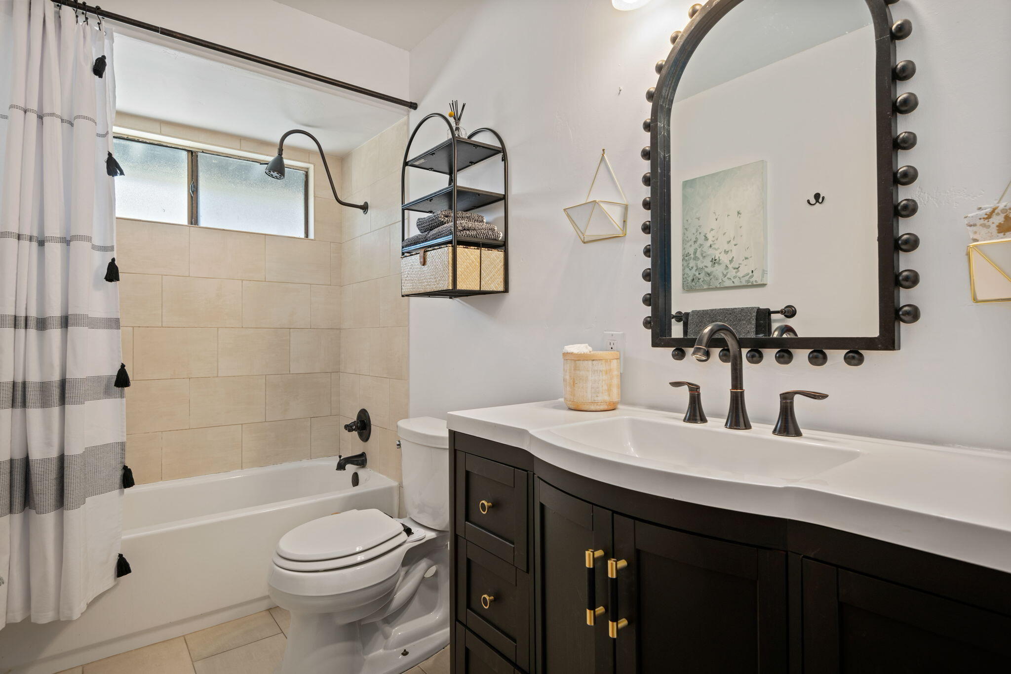793 Alisal Road Solvang, CA 93463 - Photo 23 of 44 a bathroom with a sink a toilet and shower