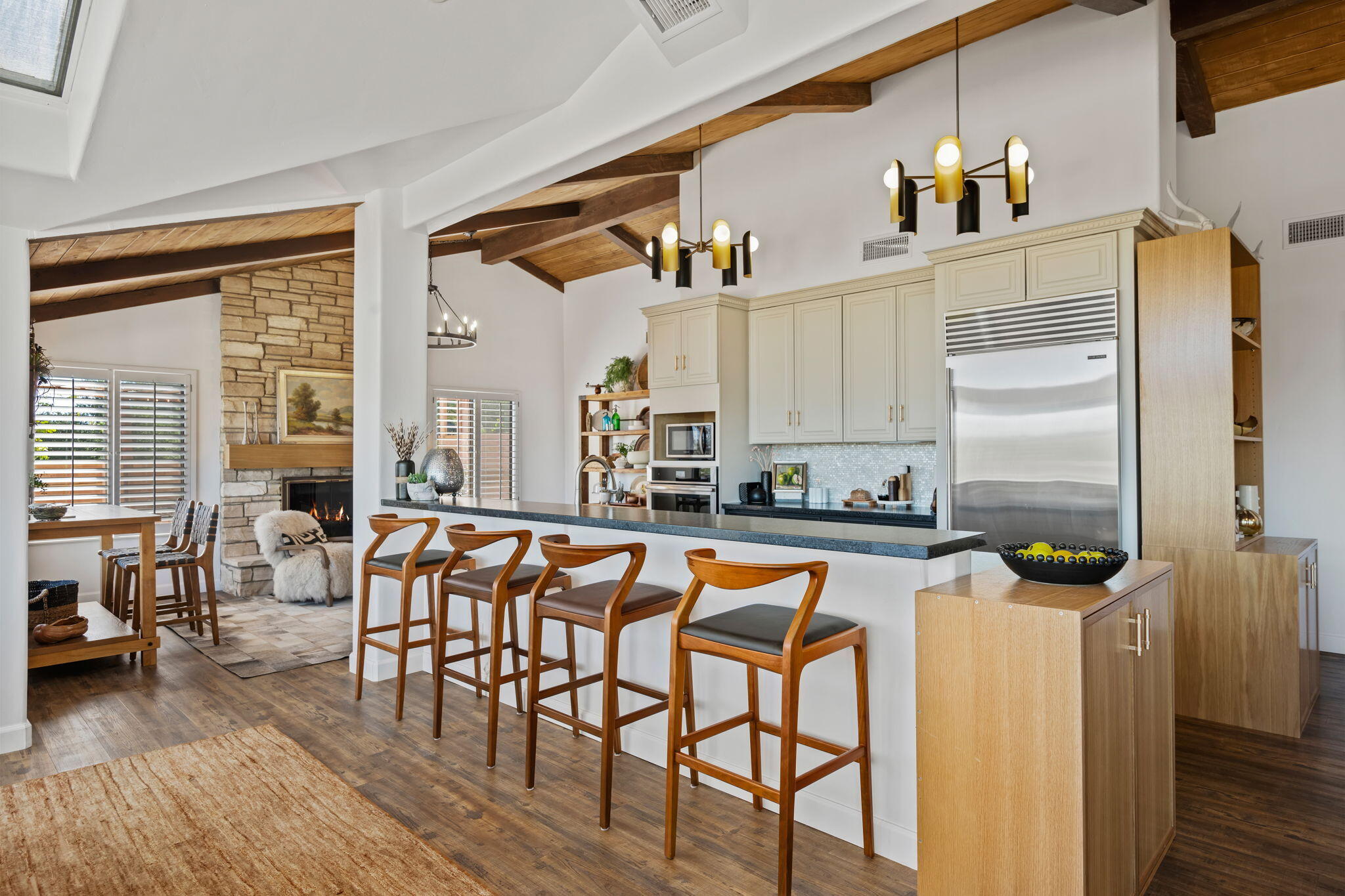793 Alisal Road Solvang, CA 93463 - Photo 6 of 44 a kitchen with stainless steel appliances a table and chairs in it
