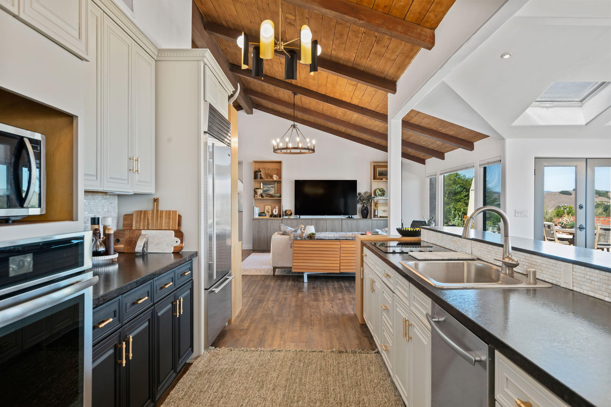 793 Alisal Road Solvang, CA 93463 - Photo 9 of 44 a large kitchen with a stove and a sink