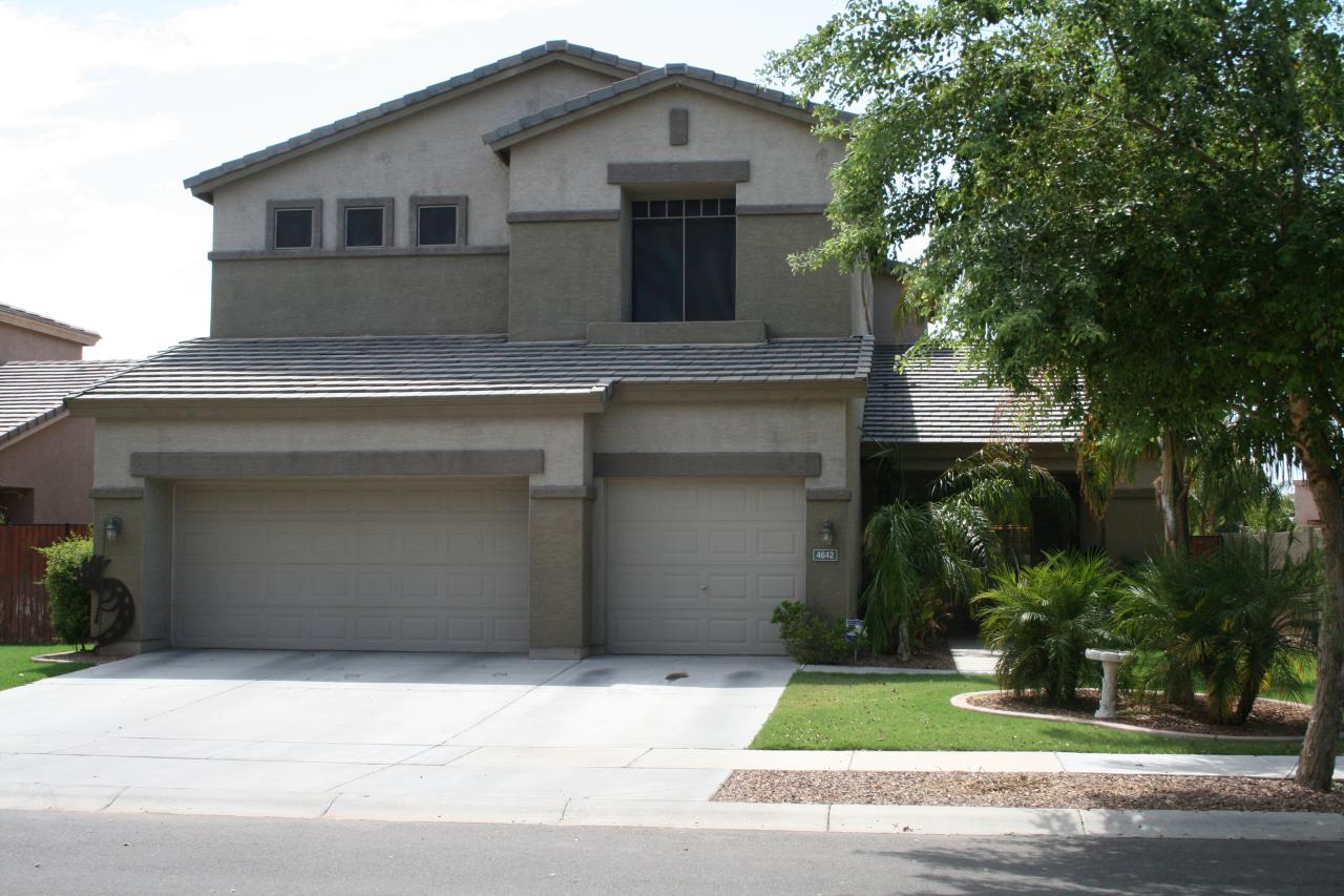 4642 South Calico Road Gilbert, AZ 85297 - Photo 1 of 20 a front view of a house with a garden and garage
