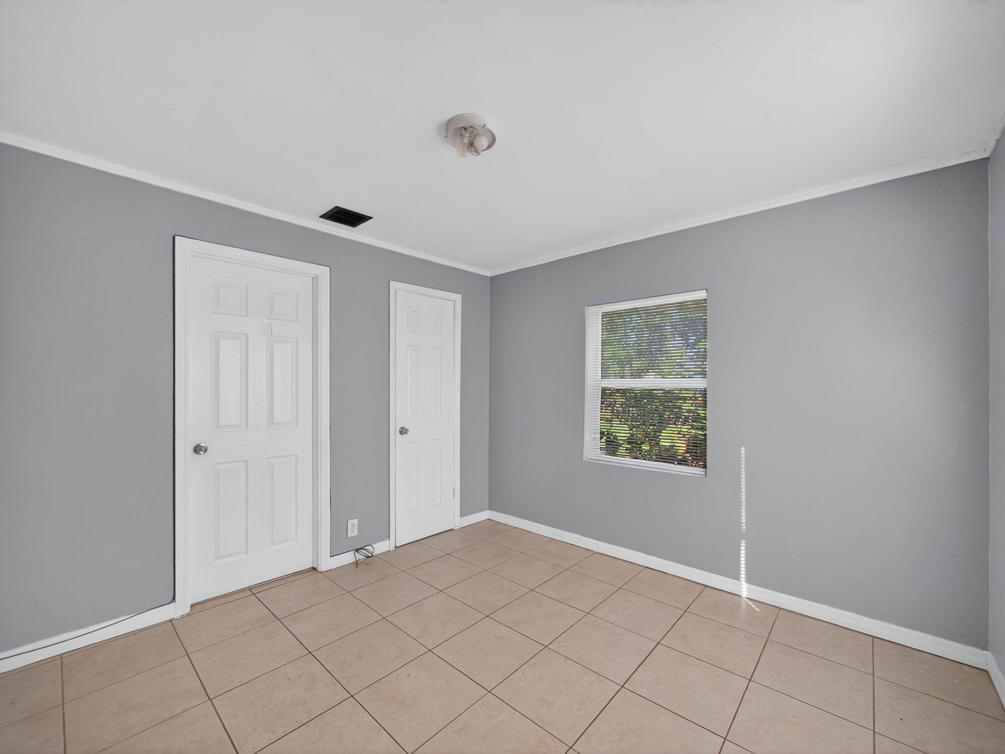 1373 West 35th Street Riviera Beach, FL 33404 - Photo 17 of 20 a view of an empty room and window