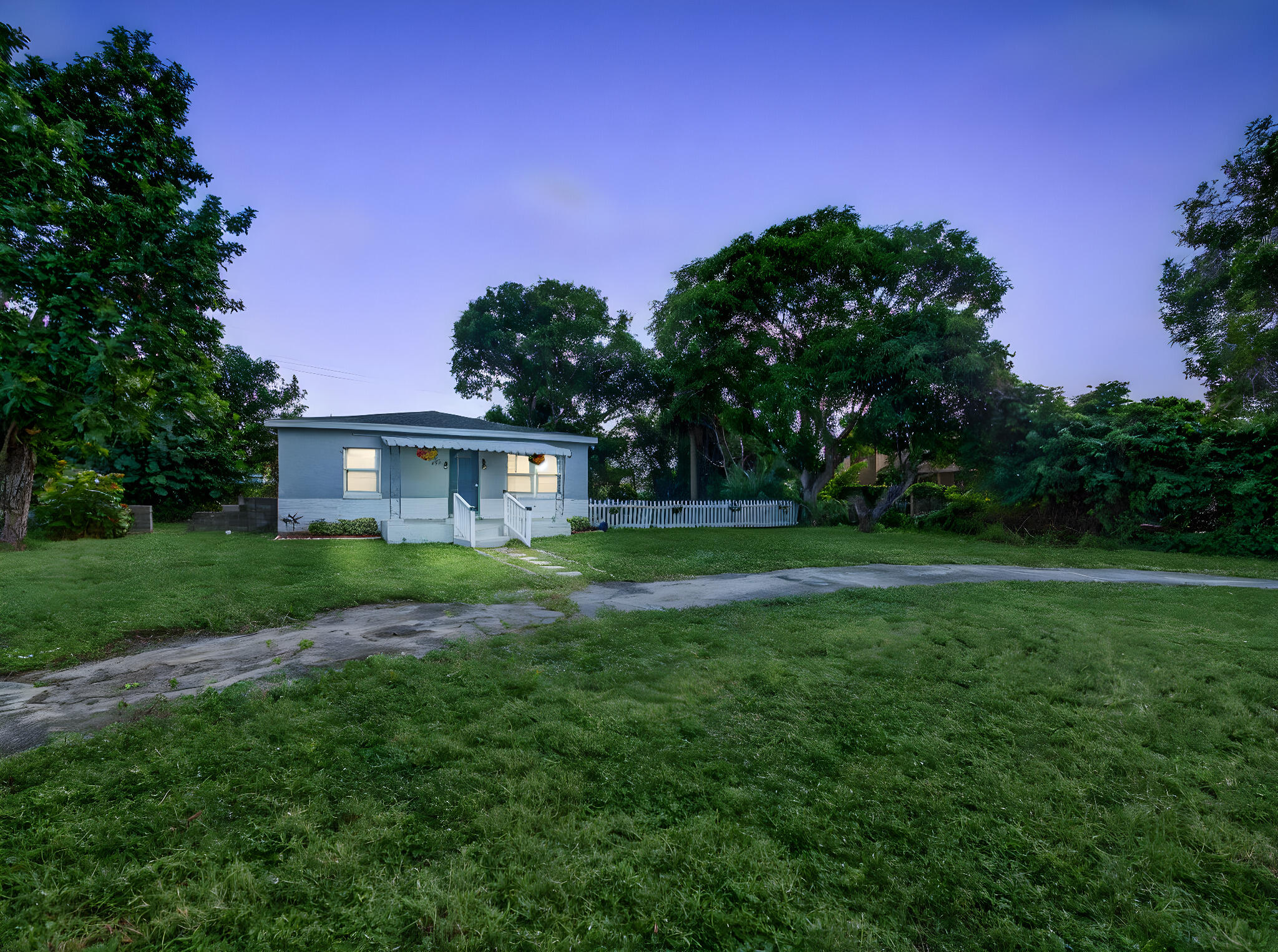 1373 West 35th Street Riviera Beach, FL 33404 - Photo 2 of 20 a view of a house with yard and a garden