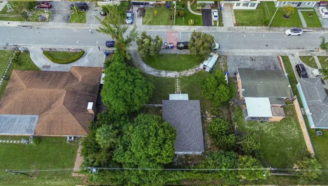 an aerial view of a house with outdoor space