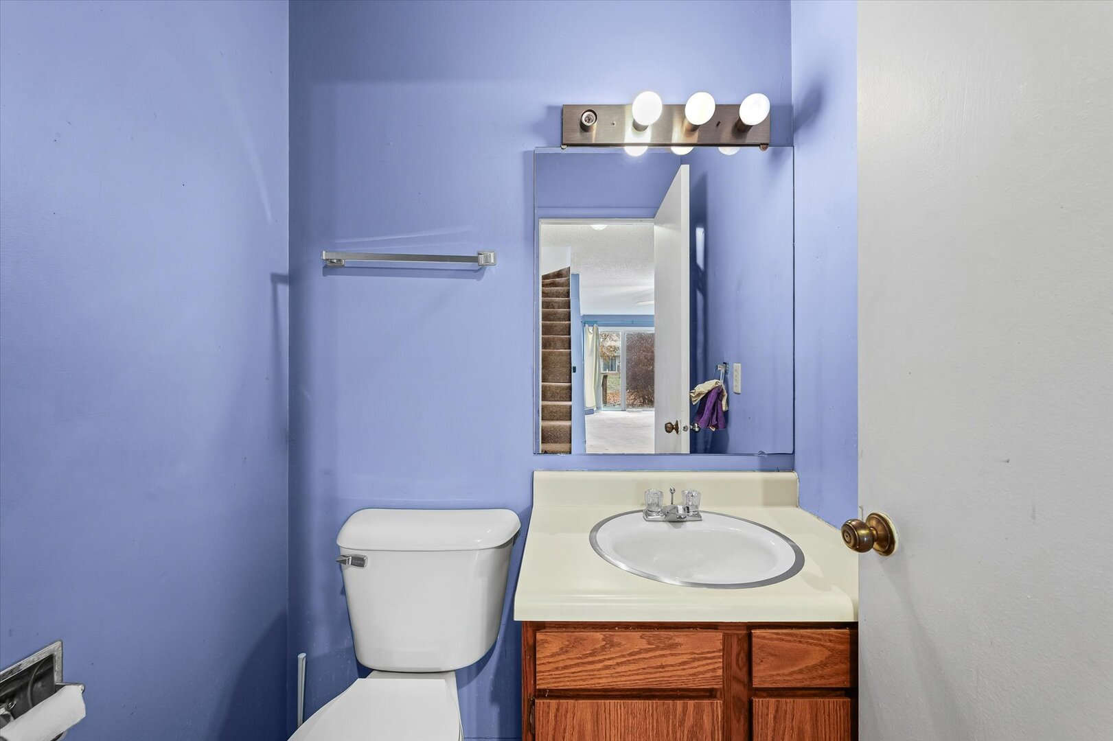1928 Blackthorn Drive, Unit 1 Champaign, IL 61821 - Photo 16 of 28 a bathroom with a toilet a sink and mirror