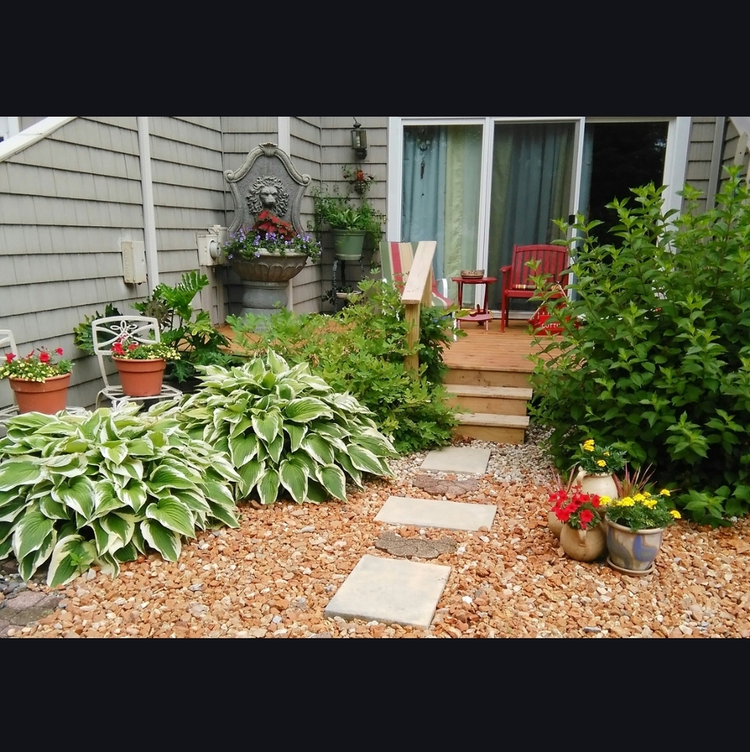 1928 Blackthorn Drive, Unit 1 Champaign, IL 61821 - Photo 26 of 28 a view of a backyard with a garden