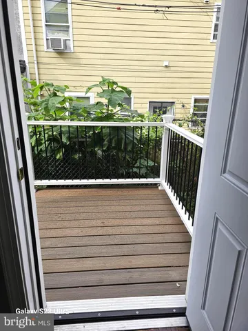 a view of a chairs and table in the patio
