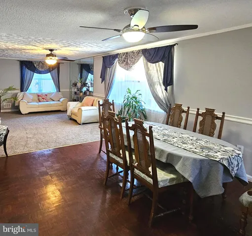 a view of a dining room with furniture and window