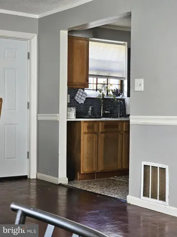 a view of a living room with furniture and window