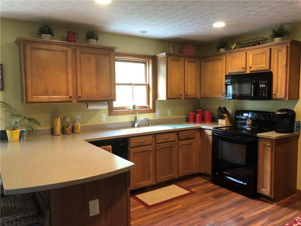 66 Old School Road Aultman, PA 15713 - Photo 11 of 23 Kitchen with a bar area