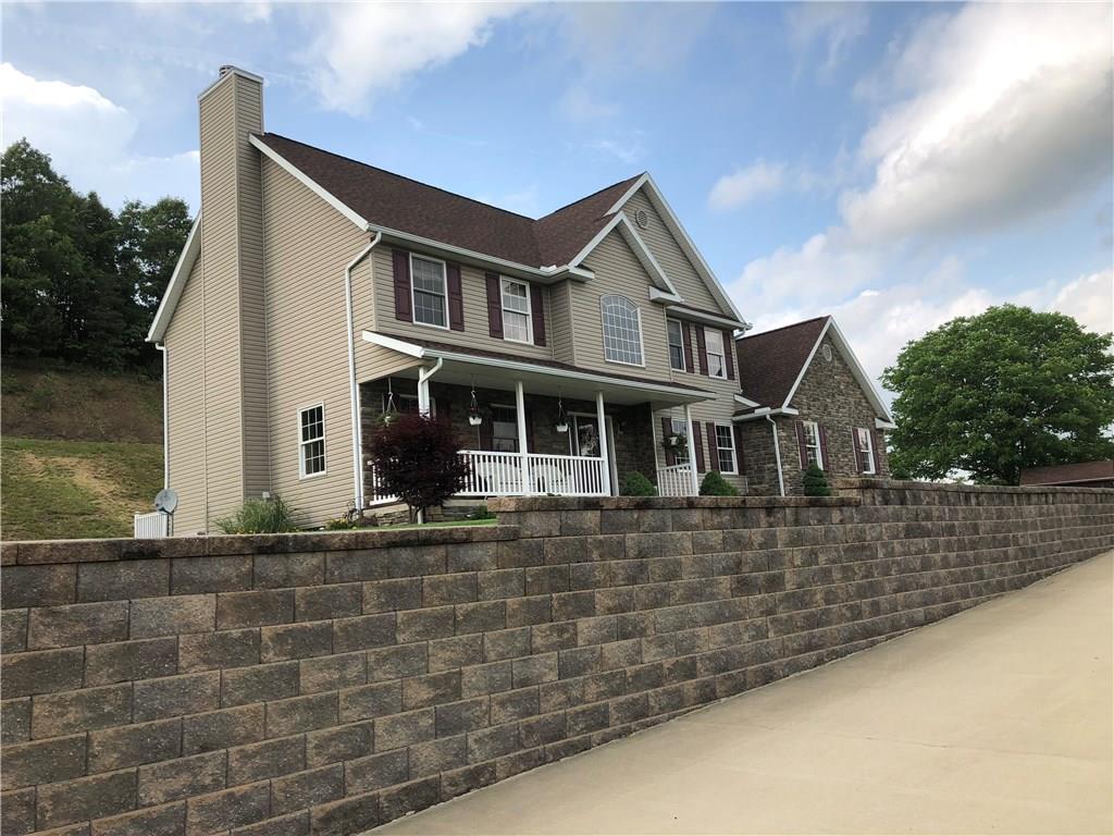 66 Old School Road Aultman, PA 15713 - Photo 7 of 23 Stone wall and concrete driveway