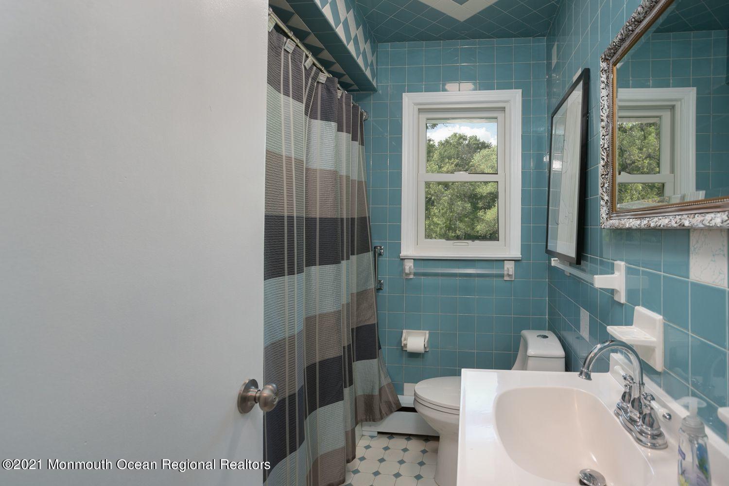 59 Aberdeen Road Matawan, NJ 07747 - Photo 14 of 34 a bathroom with a sink toilet and shower
