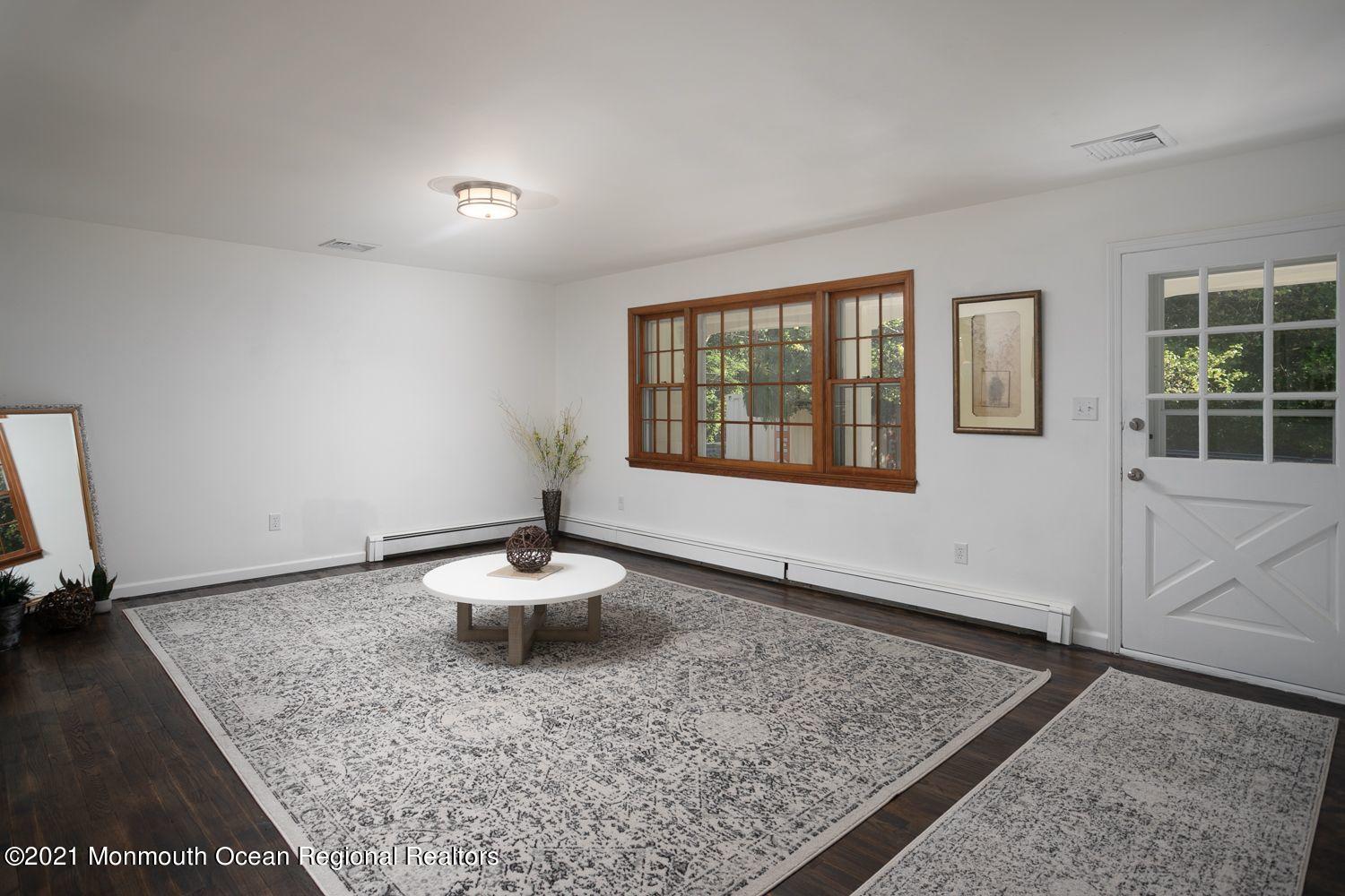 59 Aberdeen Road Matawan, NJ 07747 - Photo 4 of 34 a living room with a rug