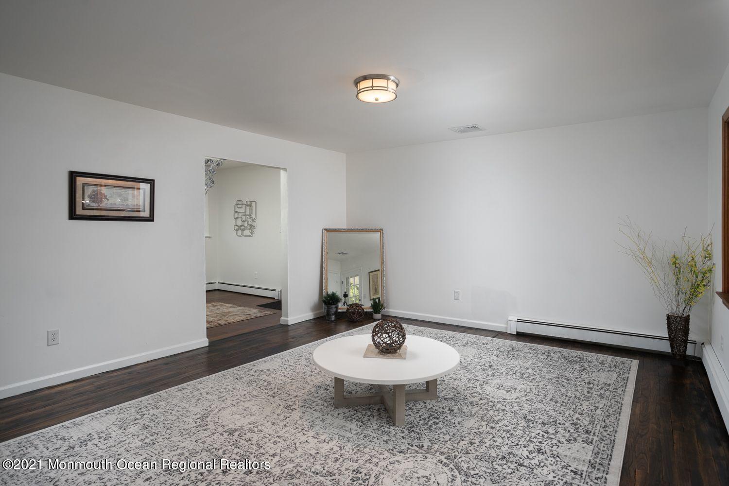 59 Aberdeen Road Matawan, NJ 07747 - Photo 5 of 34 a living room with furniture and a wooden floor