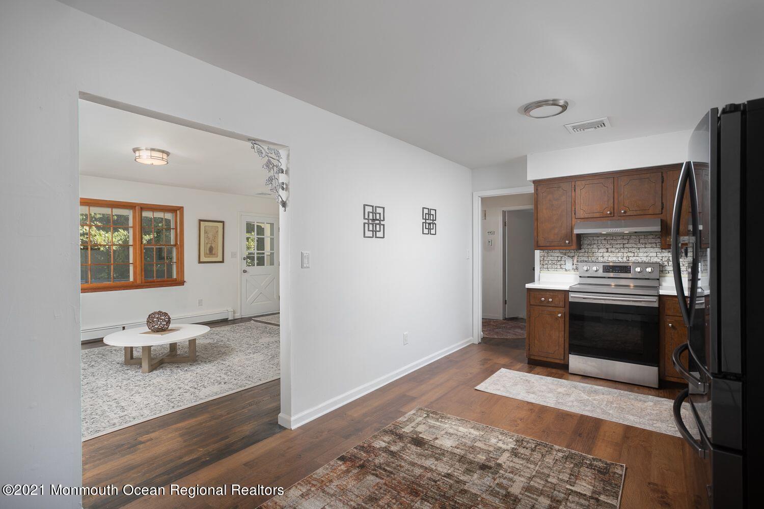 59 Aberdeen Road Matawan, NJ 07747 - Photo 8 of 34 a kitchen with a refrigerator sink and stove