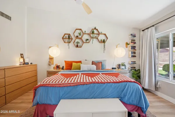 a bedroom with a bed and window