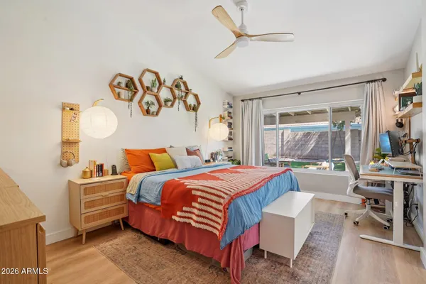 a bedroom with a bed and a table in it