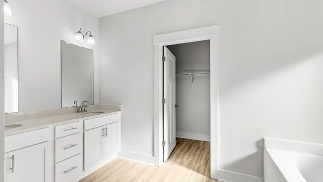 a bathroom with a bathtub and shower