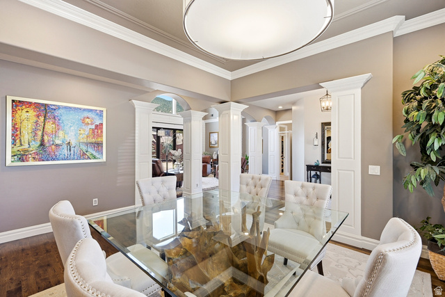 2204 Bridgewater Road Cedar City, UT 84721 - Photo 8 of 40 Formal Dining Area Featuring Hardwood Flooring, Extensive Crown Molding, and Architectural Columns Defining the Entryway