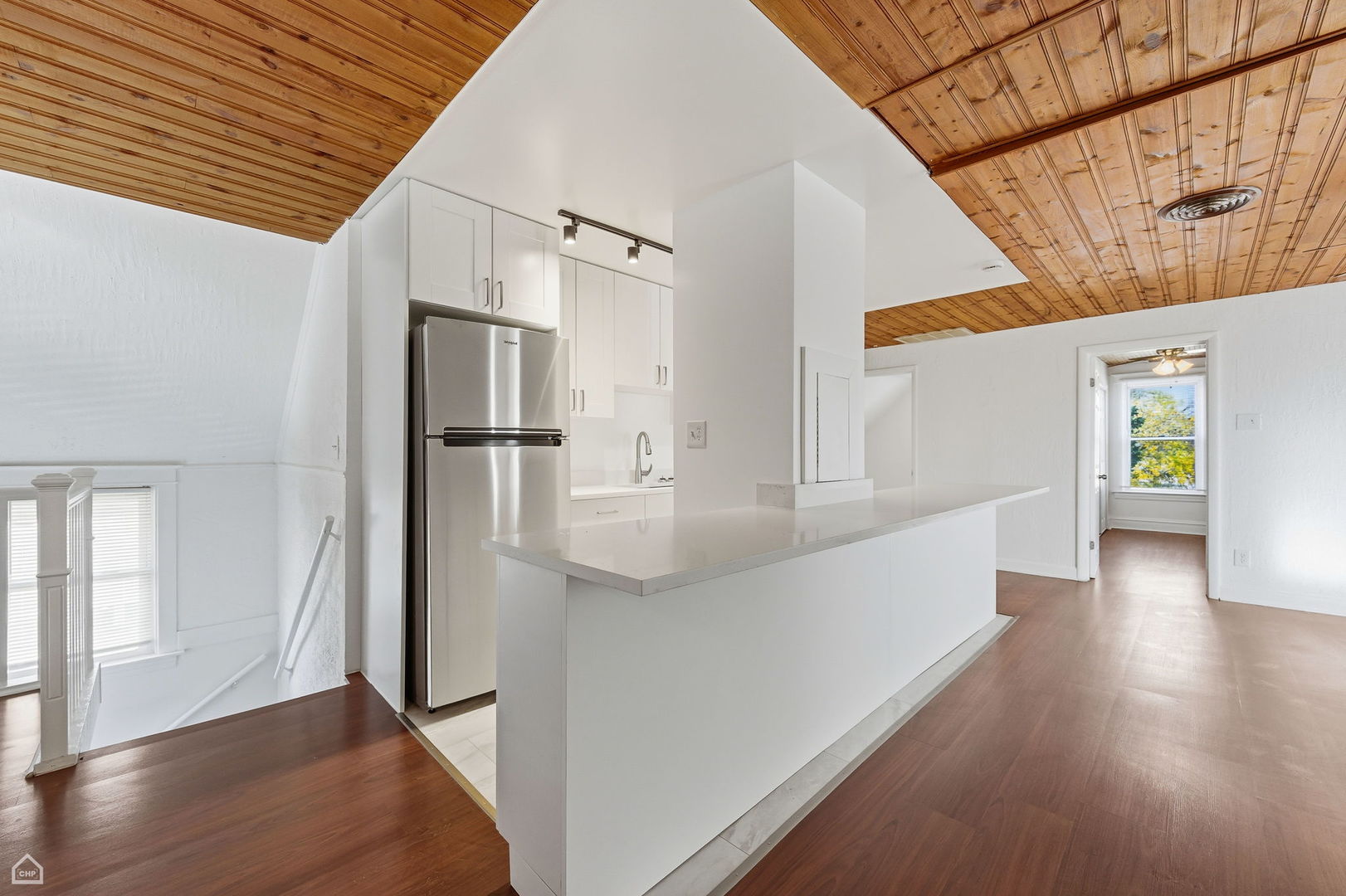 7635 West Foster Avenue Chicago, IL 60656 - Photo 15 of 24 a view of a hallway with wooden floor and staircase