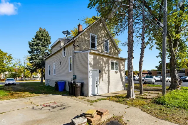 a view of a house with snow on the road