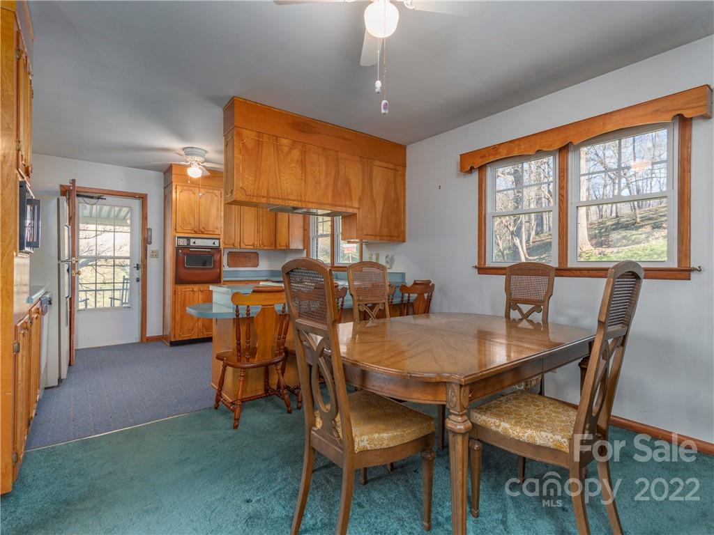 1179 Max Thompson Road Canton, NC 28716 - Photo 14 of 41 a view of a dining room with furniture window and outside view