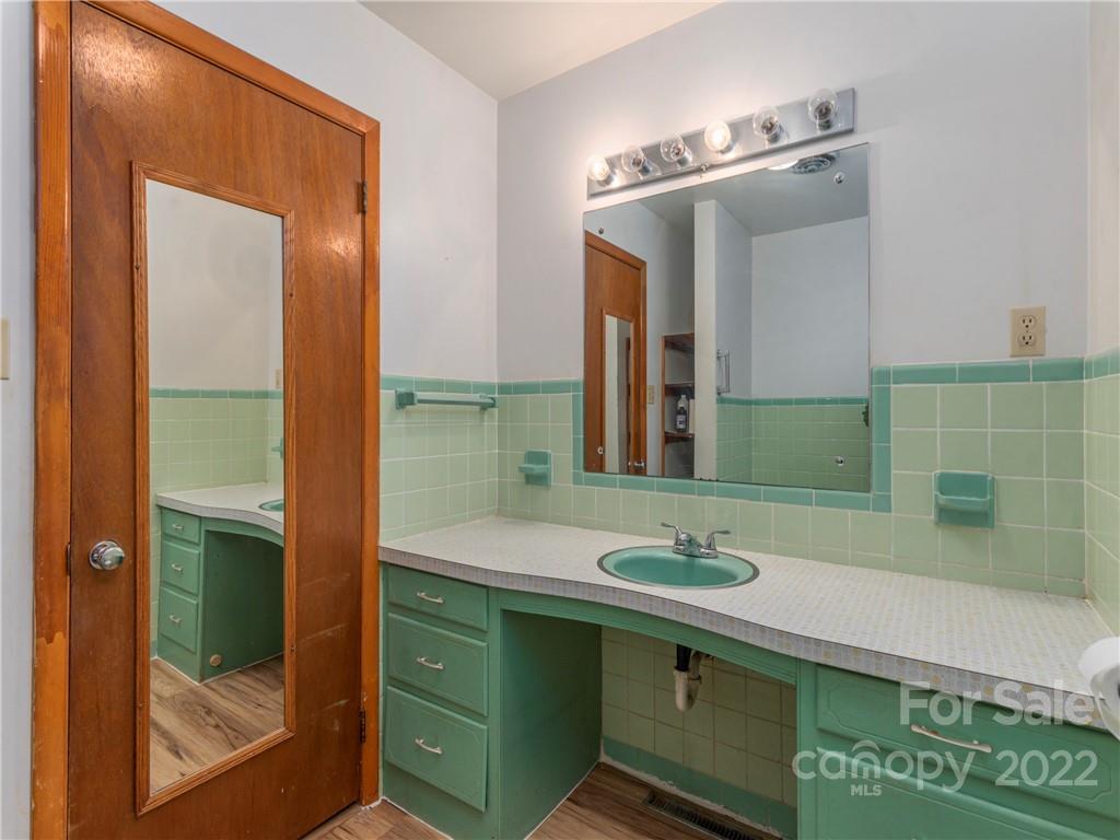 1179 Max Thompson Road Canton, NC 28716 - Photo 19 of 41 a bathroom with a sink and a mirror