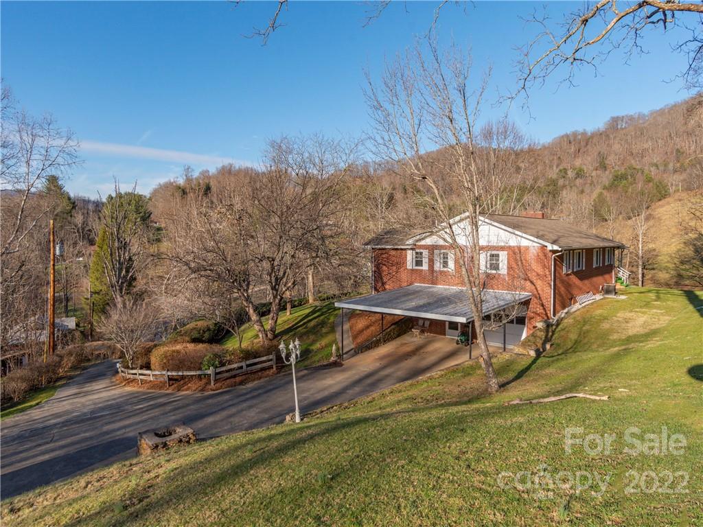 1179 Max Thompson Road Canton, NC 28716 - Photo 2 of 41 a view of a house with a yard