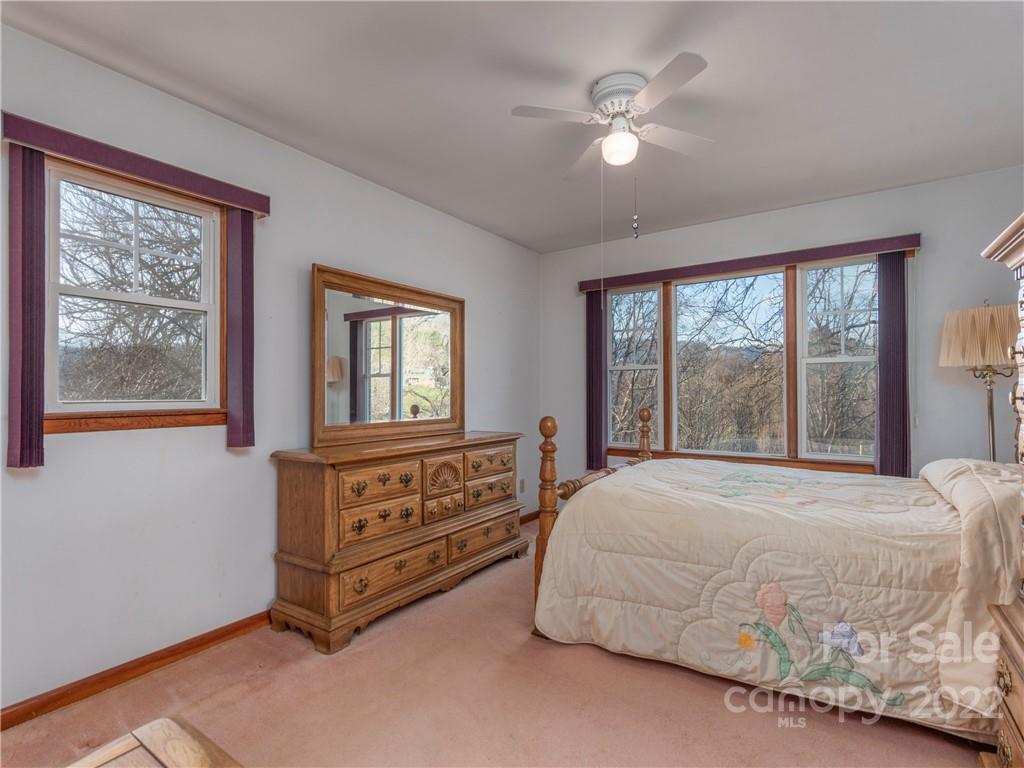 1179 Max Thompson Road Canton, NC 28716 - Photo 21 of 41 a bedroom with a bed dresser and a window
