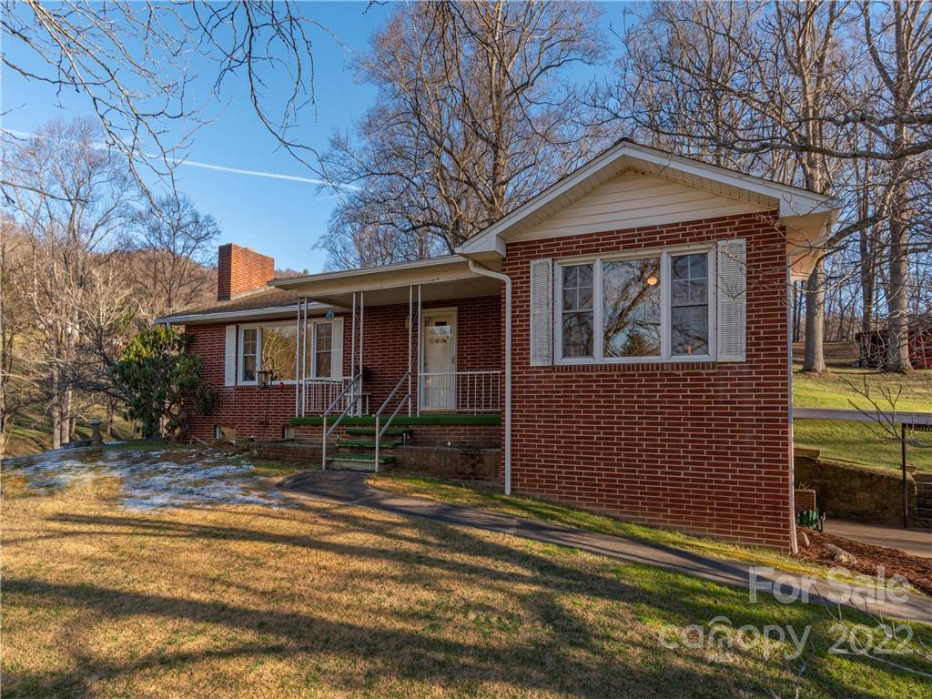 1179 Max Thompson Road Canton, NC 28716 - Photo 27 of 41 a front view of a house with a yard