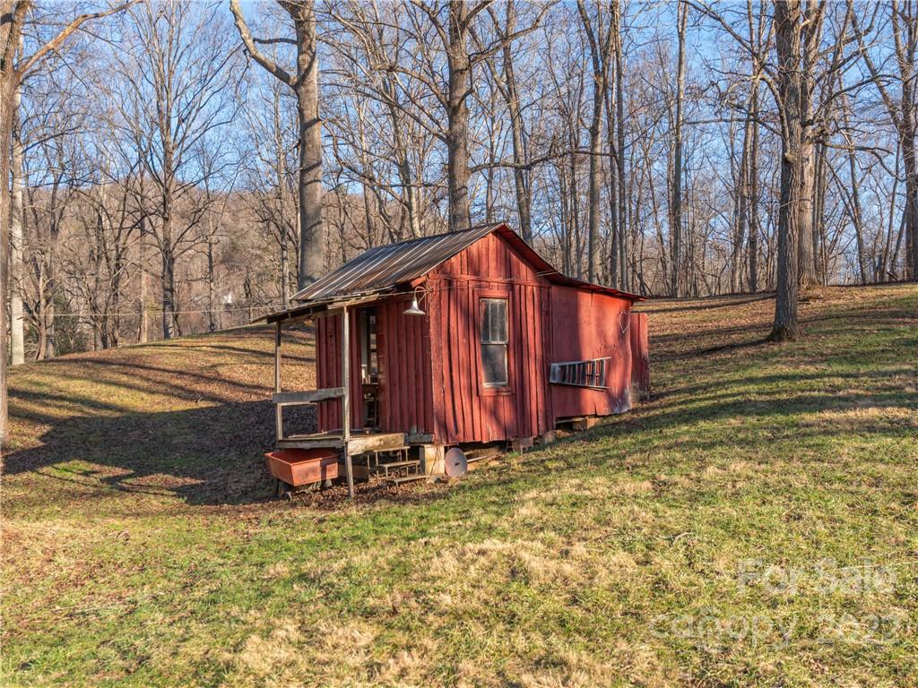 1179 Max Thompson Road Canton, NC 28716 - Photo 29 of 41 a view of a house with backyard and trees