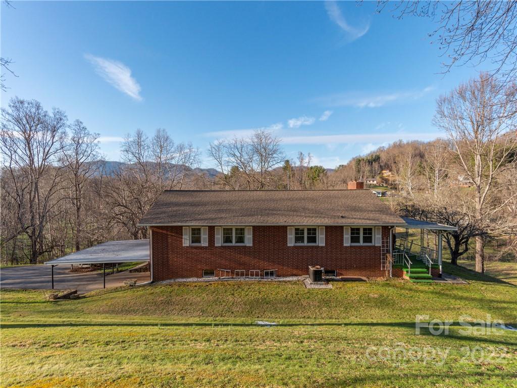 1179 Max Thompson Road Canton, NC 28716 - Photo 4 of 41 a view of a house with a swimming pool