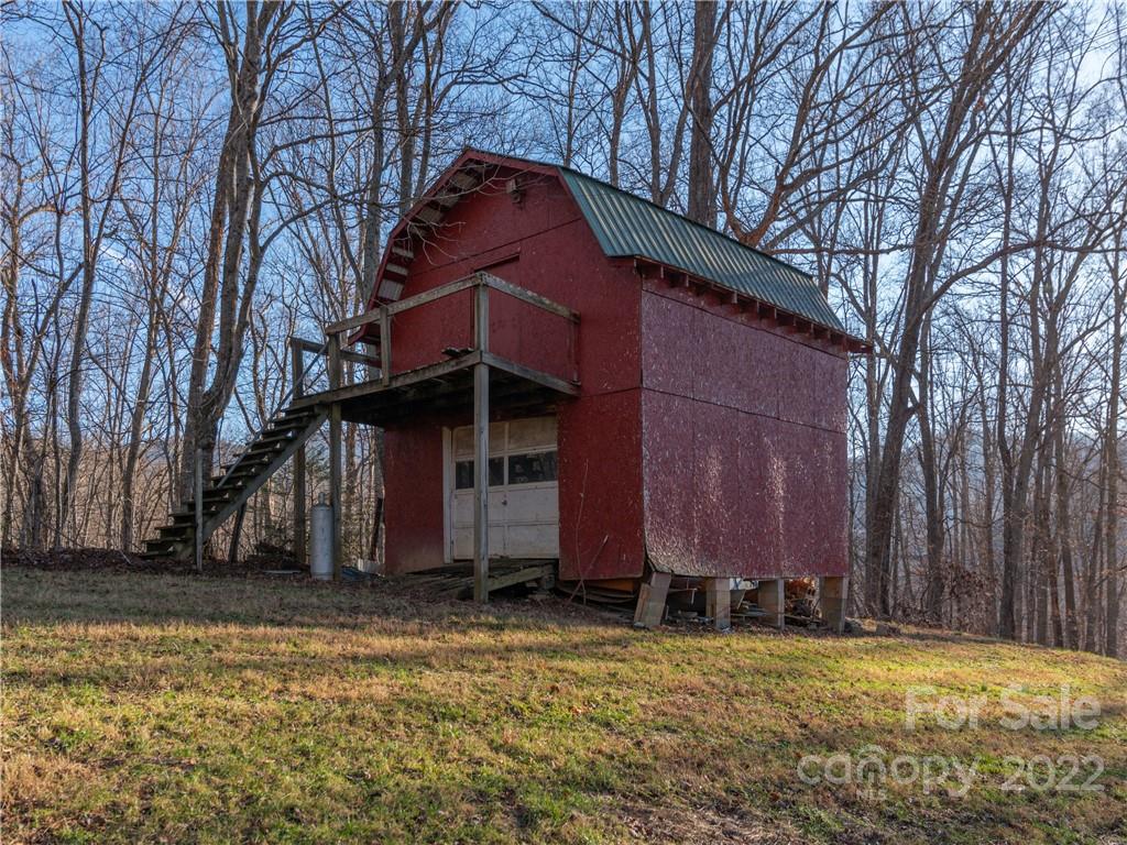 1179 Max Thompson Road Canton, NC 28716 - Photo 8 of 41 a view of a house with a yard