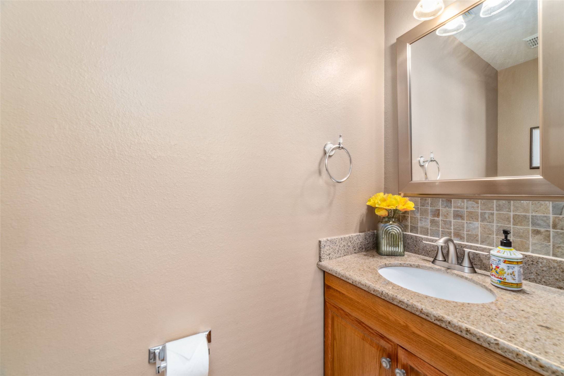 203 West Stedhill Loop Conroe, TX 77384 - Photo 14 of 45 a bathroom with a granite countertop sink and a mirror