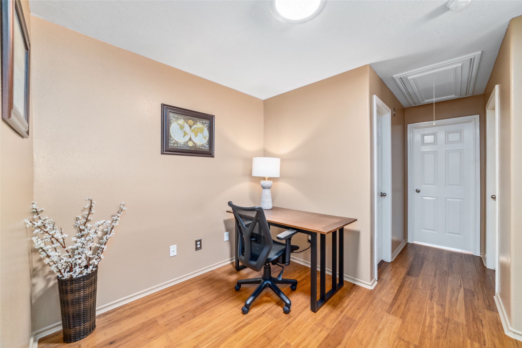 203 West Stedhill Loop Conroe, TX 77384 - Photo 19 of 45 a view of a workspace with furniture and wooden floor