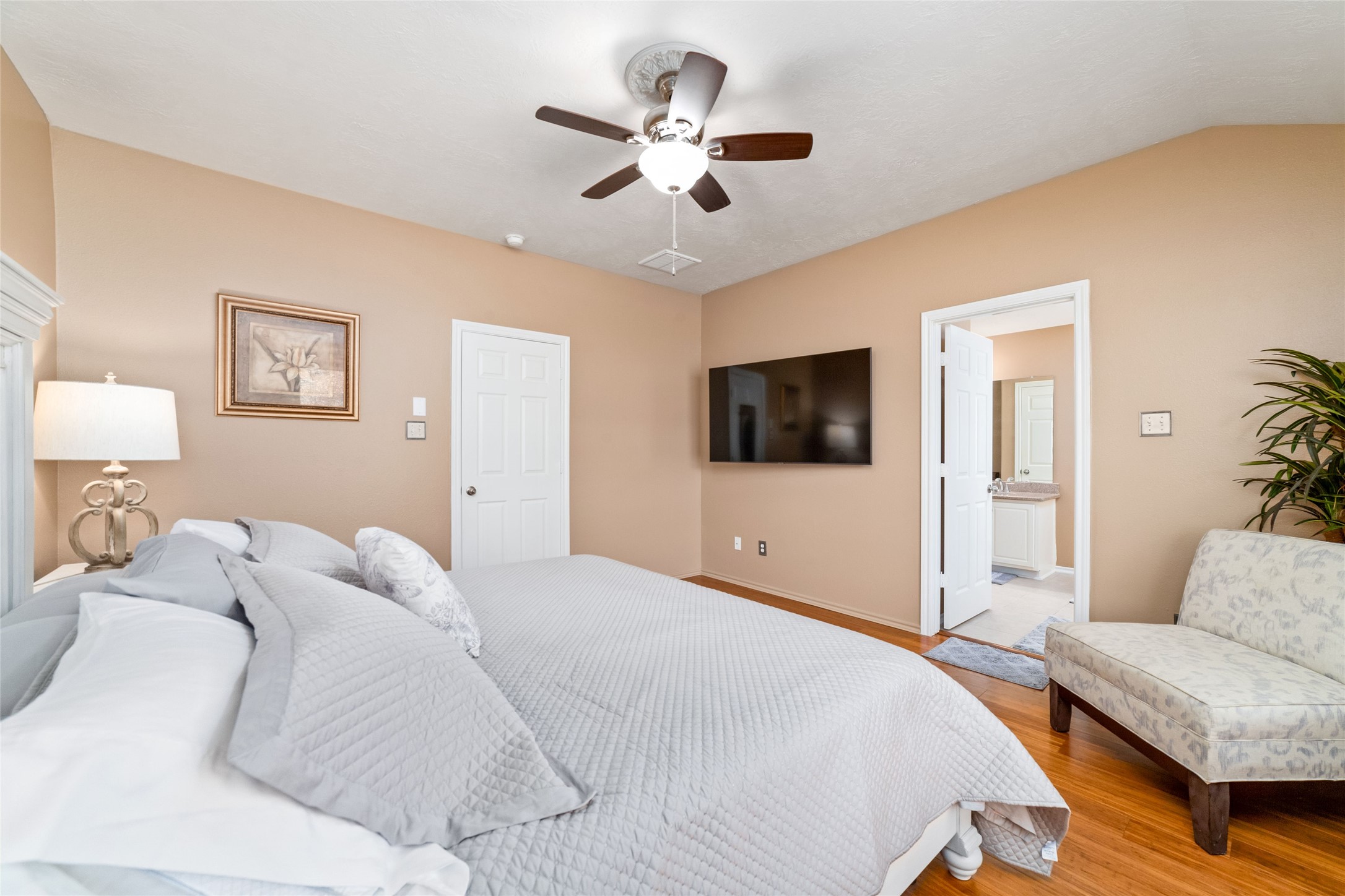 203 West Stedhill Loop Conroe, TX 77384 - Photo 27 of 45 a bedroom with a large bed and a tv