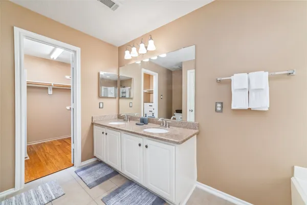 a bathroom with a granite countertop sink mirror and a