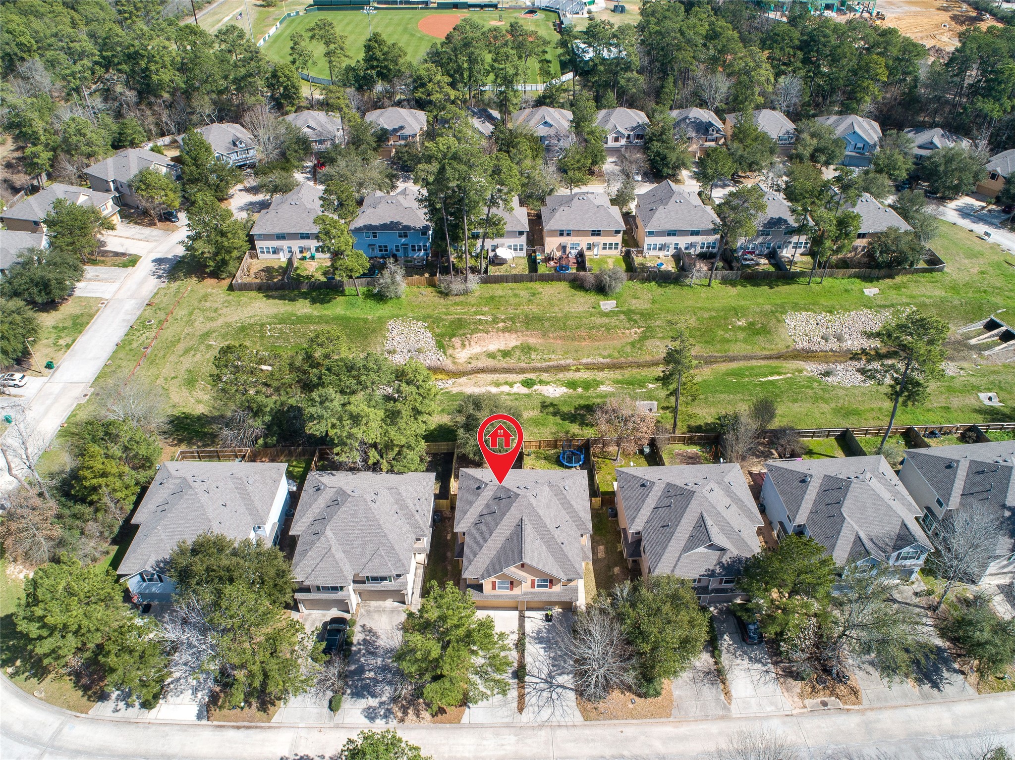 203 West Stedhill Loop Conroe, TX 77384 - Photo 36 of 45 an aerial view of a houses with outdoor space and lake view