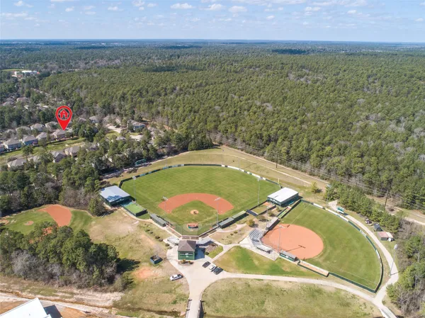 a view of a swimming pool with a yard