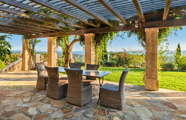 a view of swimming pool with outdoor seating