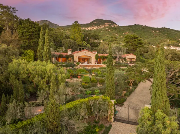 a view of a city with mountains in the background