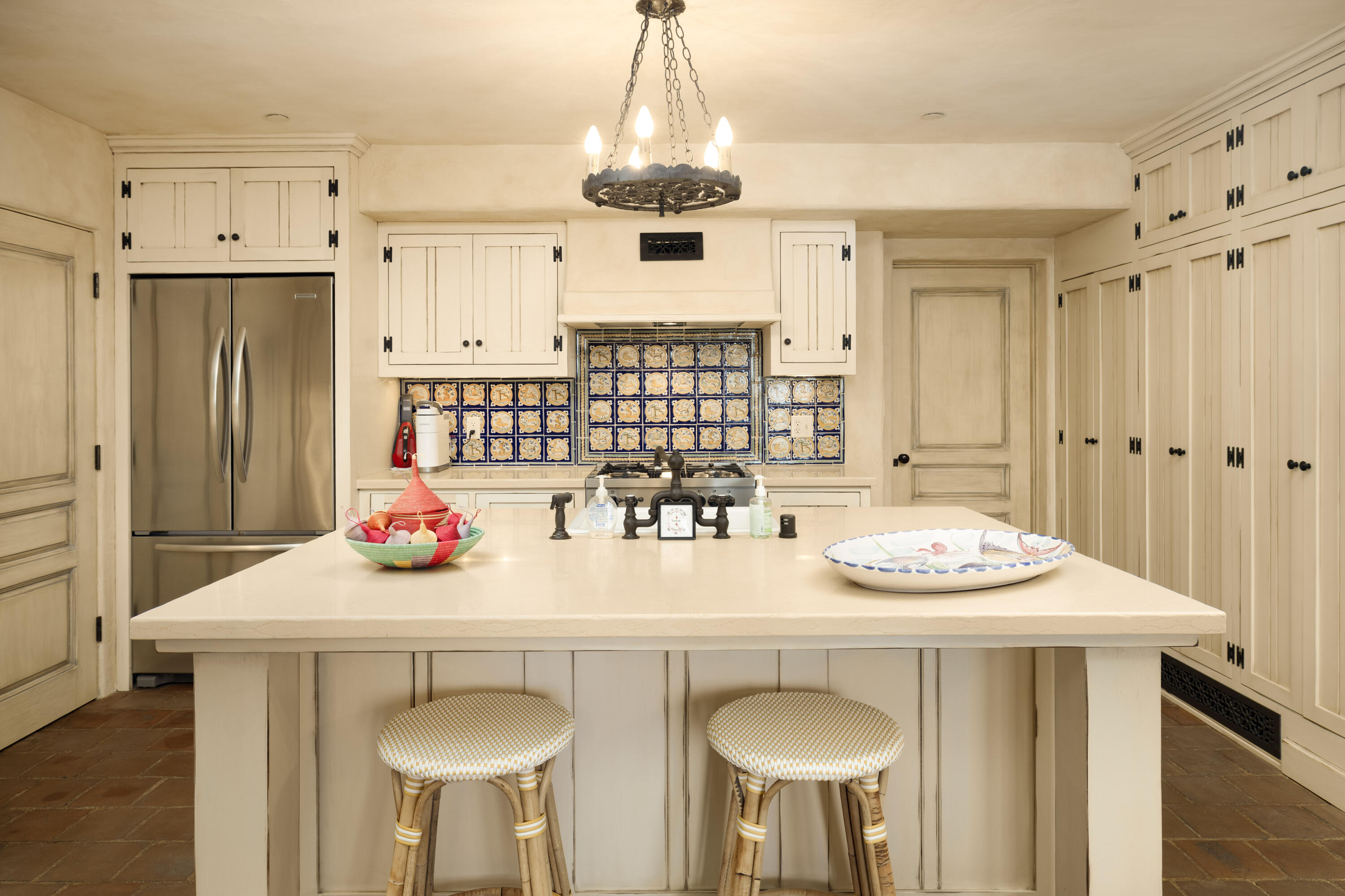 965 Brooktree Road Montecito, CA 93108 - Photo 24 of 26 a kitchen with stainless steel appliances a dining table and chairs
