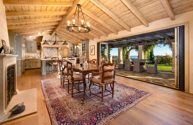 a view of a dining room with furniture wooden floor and a rug